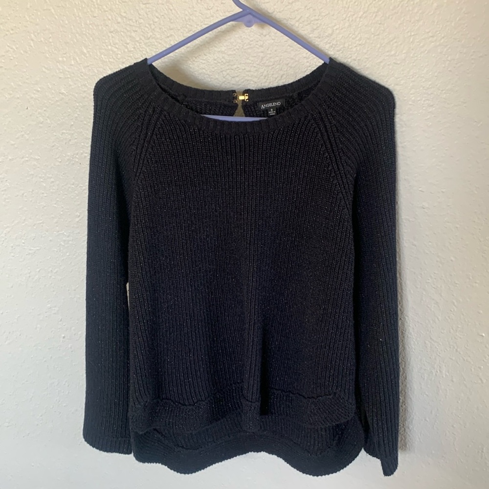 Size small knitted black sweater. Never work but did remove the tags.